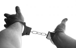 criminal in handcuffs