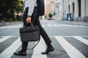 businessman carrying laptop