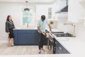 man inspecting kitchen 